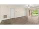 Living room featuring hardwood floors and sliding glass doors to the outside area at 8617 Coralbell Ln, Charlotte, NC 28213