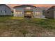 Large backyard at dusk showing the back of the house, and covered porch at 873 Penny Royal Ave, Fort Mill, SC 29715