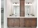 Bathroom featuring double sinks, quartz counters, and wooden cabinets at 873 Penny Royal Ave, Fort Mill, SC 29715
