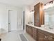 Bathroom showcasing double sinks, custom cabinetry, and a neutral color palette at 873 Penny Royal Ave, Fort Mill, SC 29715
