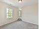 Bright bedroom with neutral walls, carpet, and windows that provide ample natural light at 873 Penny Royal Ave, Fort Mill, SC 29715