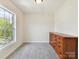 Bedroom with natural light and dresser, showcasing a calm and inviting space at 873 Penny Royal Ave, Fort Mill, SC 29715