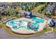 This community features a pool and splashpad with water features and covered seating areas at 873 Penny Royal Ave, Fort Mill, SC 29715