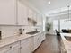 Contemporary kitchen featuring granite counters, white subway tile backsplash, and stainless steel appliances at 873 Penny Royal Ave, Fort Mill, SC 29715