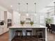 Bright kitchen featuring granite countertops, a large center island with seating, and modern pendant lighting at 873 Penny Royal Ave, Fort Mill, SC 29715