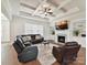 Inviting living room with a coffered ceiling, fireplace, built-in shelves, and comfortable seating at 873 Penny Royal Ave, Fort Mill, SC 29715