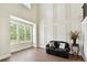 Bright living room featuring a large window, hardwood floors, and a comfortable seating area at 873 Penny Royal Ave, Fort Mill, SC 29715