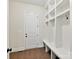 Mud room with built-in storage cubbies, bench and coat hooks offering practical organization solutions at 873 Penny Royal Ave, Fort Mill, SC 29715