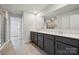 This bathroom features a dual sink vanity with dark cabinets and granite countertops at 9940 Manor Vista Trl, Kannapolis, NC 28027