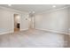 This bedroom has plush carpeting, recessed lighting, and two doors, one leading to an ensuite bathroom at 9940 Manor Vista Trl, Kannapolis, NC 28027