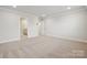 A large bedroom with plush carpet and walk-in closet provides ample space at 9940 Manor Vista Trl, Kannapolis, NC 28027