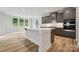 The kitchen showcases quartz countertops, a large kitchen island, and stainless steel appliances at 9940 Manor Vista Trl, Kannapolis, NC 28027
