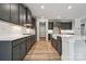Spacious kitchen featuring quartz countertops, a large island, and modern stainless steel appliances at 9940 Manor Vista Trl, Kannapolis, NC 28027