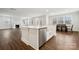 Bright kitchen island, with modern appliances and open floor plan to dining and living area at 9940 Manor Vista Trl, Kannapolis, NC 28027