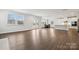 Bright, expansive living space seamlessly connects to a kitchen, dining area, and outdoor access at 9940 Manor Vista Trl, Kannapolis, NC 28027