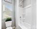 Bright bathroom featuring a toilet and tub-shower at 1022 Doughton Ln, Indian Trail, NC 28079