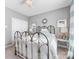 Bedroom featuring a metal framed bed and lots of natural light at 1022 Doughton Ln, Indian Trail, NC 28079