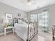 Cozy bedroom with stylish metal bed frame, neutral walls, and bright natural light at 1022 Doughton Ln, Indian Trail, NC 28079