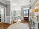 Beautiful foyer with wood floors, detailed trim, natural light, and an open view into the living area at 1022 Doughton Ln, Indian Trail, NC 28079