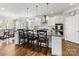 Modern kitchen featuring a large island, granite countertops, stainless steel appliances, and ample cabinet space at 1022 Doughton Ln, Indian Trail, NC 28079