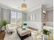Bright living room with elegant white chairs, natural light, and decorative accents at 1022 Doughton Ln, Indian Trail, NC 28079