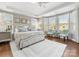 Serene main bedroom featuring tray ceilings, natural light, and a calming color scheme at 1022 Doughton Ln, Indian Trail, NC 28079