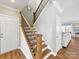 View of a staircase with wood and iron railings, with natural light at 1022 Doughton Ln, Indian Trail, NC 28079