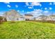 Expansive backyard bordered by trees and fences, providing a private outdoor space at 10223 Kelso Ct, Charlotte, NC 28278