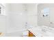 Bathroom features white tile enclosure, sink, toilet and mirror at 10223 Kelso Ct, Charlotte, NC 28278