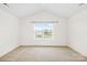 Bedroom features neutral carpet, walls, trim, and a window at 10223 Kelso Ct, Charlotte, NC 28278