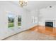 Inviting breakfast nook with french doors, and view to the living room with fireplace at 10223 Kelso Ct, Charlotte, NC 28278