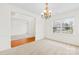 Bright dining room features plush carpet, chair railing, and a chandelier at 10223 Kelso Ct, Charlotte, NC 28278