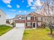 Beautiful brick home with a two-car garage, manicured lawn, and a long driveway at 10223 Kelso Ct, Charlotte, NC 28278