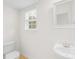 Neat half-bath with stylish sink, fixtures, and window for natural light at 10223 Kelso Ct, Charlotte, NC 28278