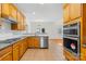 Stylish kitchen boasts granite countertops, modern appliances, and an open layout at 10223 Kelso Ct, Charlotte, NC 28278
