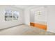 Cozy living room with neutral paint, plush carpet, and a large window at 10223 Kelso Ct, Charlotte, NC 28278