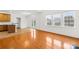 Sun-drenched living area showcases hardwood floors and french doors to the backyard at 10223 Kelso Ct, Charlotte, NC 28278