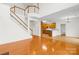 Hardwood floors flow throughout this living space with staircase and kitchen visible at 10223 Kelso Ct, Charlotte, NC 28278