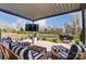 Outdoor relaxation awaits on the covered patio in this large fenced backyard at 10321 Solar Way, Charlotte, NC 28278
