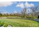 Large fenced backyard with green grass and trees at 10321 Solar Way, Charlotte, NC 28278