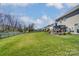 Spacious backyard with a covered patio and ample green space at 10321 Solar Way, Charlotte, NC 28278
