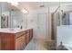 Well-lit bathroom with double sink vanity, shower, and ceramic tile floors at 10321 Solar Way, Charlotte, NC 28278