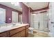 Neat bathroom with a single vanity, toilet, and glass shower doors at 10321 Solar Way, Charlotte, NC 28278