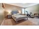 Cozy bedroom with queen bed, matching nightstands, and exercise bike at 10321 Solar Way, Charlotte, NC 28278