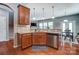 Kitchen featuring wood cabinets, stainless steel appliances, and granite countertops at 10321 Solar Way, Charlotte, NC 28278