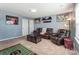 Spacious living room features leather furniture, football decor, and natural light at 10321 Solar Way, Charlotte, NC 28278
