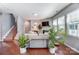 Open-concept living room with hardwood floors, a fireplace, and stairs to the upper level at 10321 Solar Way, Charlotte, NC 28278