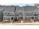 A sprawling community of gray townhomes, complete with modern architecture, manicured landscaping, and neighborhood charm at 104 Ciara Pl # B, Mooresville, NC 28117