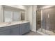 Modern bathroom with double vanity, framed shower, and ceramic tile at 104 Ciara Pl # B, Mooresville, NC 28117