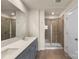 Modern bathroom featuring a double sink vanity with quartz countertop and walk-in shower with glass door at 104 Ciara Pl # B, Mooresville, NC 28117